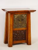Arts & Crafts oak mantel clock, embossed metal dial, carved oak leaf and acorn panel below,