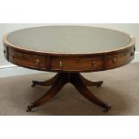 Reproduction mahogany circular drum table, inset leather top, on four splayed supports,