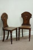 Pair Victorian oak shaped back hall chairs,