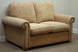 Two seat sofa upholstered in pale gold fabric,