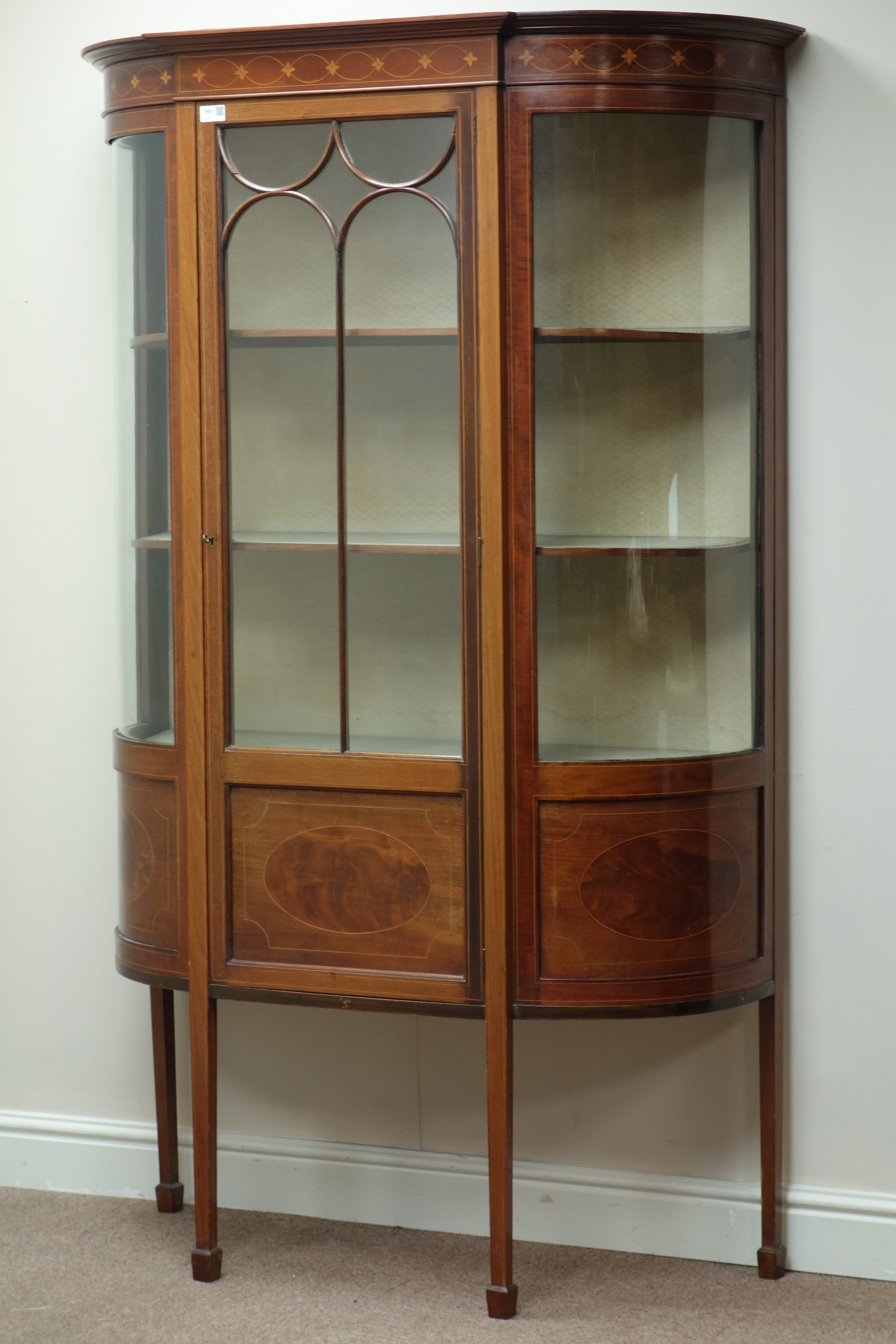 Edwardian inlaid mahogany display cabinet, curved sides, central astragal glazed door,