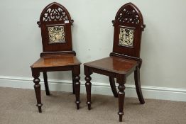 Pair Victorian oak Gothic revival hall chairs, set with John Moyr Smith 'Alfred' type tiles,