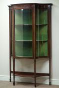 Edwardian mahogany serpentine display cabinet, curved glass panels,