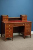 Edwardian inlaid mahogany kneehole writing desk, nine drawers,
