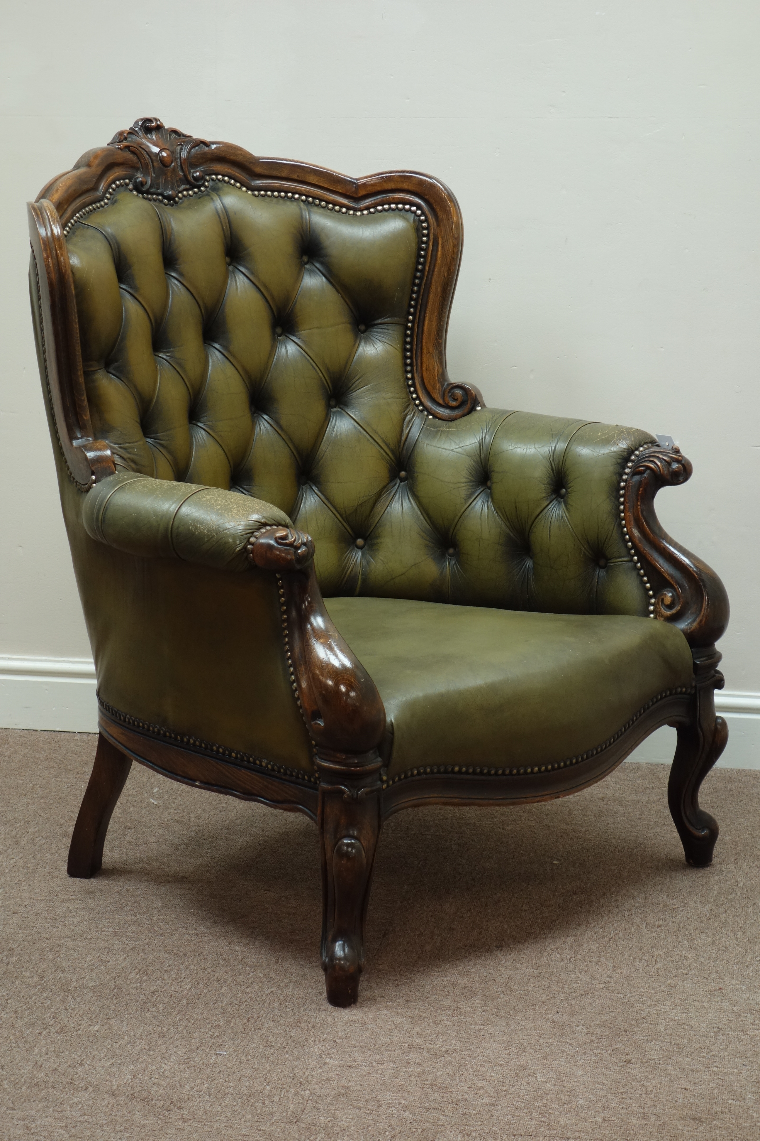 Early 20th century beech framed armchair, wide serpentine seat, upholstered seat and buttoned back,