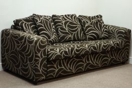 Four seat sofa upholstered in swirl patterned fabric,