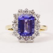 Tanzanite and diamond cluster ring hallmarked 18ct (tanzanite approx 2 carat) Condition