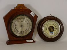 Early 20th century aneroid barometer mounted on oak stand and another wall hanging aneroid