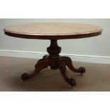 Victorian walnut loo table, oval tilt top, carved baluster column, four splayed legs, 136cm x 105cm,