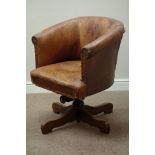 Early 20th century oak framed tub shaped swivel office chair, upholstered in antique leather,