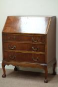 Reproduction mahogany bureau, fall front with fitted interior, three drawers, on ball and claw feet,