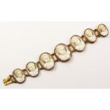 Shell cameo bracelet comprising seven oval cameos depicting cherubs gilt metal mounted 17cm