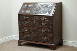Early Georgian heavily carved oak bureau, fall front with fitted interior,