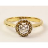 Diamond and yellow sapphire halo set gold ring ( diamond approx 0.