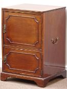 19th century mahogany bedside cabinet, enclosed by two cupboard doors, with carrying handles, W47cm,