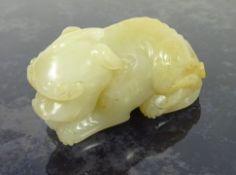 Chinese pale Celadon jade carving of a recumbent lion - dog, L6.