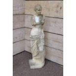 Classical style composite stone figure of a nude woman,