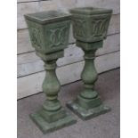 Pair composite stone square planters on pedestals,