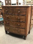 Victorian mahogany bow front chest, two short and three long drawers, turned feet, W107cm, H127cm,