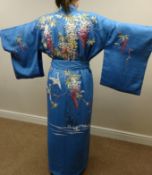 Japanese blue silk kimono embroidered with cranes and blossom,