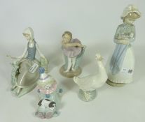 Lladro figure of a seated woman and a clown with a puppy and three other Nao figures (5)