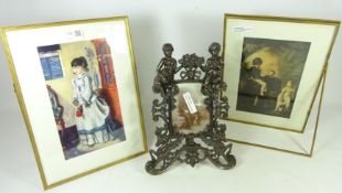 Pair of double sided gilded metal easel picture frames with bevelled edge and a cast iron easel