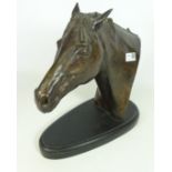 Cast bronze sculpture of a horse's head, inscribed Dove,