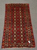 Persian Baluchi red ground rug, geometric design,