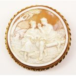 Large circular cameo brooch depicting courting couple in hallmarked 9ct gold twist surround 7cm