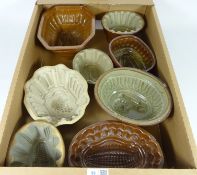 Eight Victorian pottery Jelly moulds including two Lions, Swan,