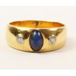 Gold band set with a cabachon sapphire and two diamonds stamped 585 approx 6gm Condition