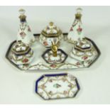 Noritake dressing table set, painted with roses within gilt scroll borders, on rectangular tray,