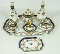 Noritake dressing table set, painted with roses within gilt scroll borders, on rectangular tray,