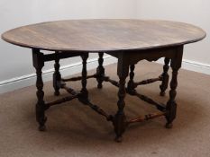 Early 20th century William & Mary style oak drop leaf table on turned double gate leg base,