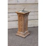 Brass sundial on square terracotta pedestal with moulded decoration and twist corners,
