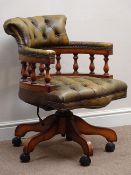 Swivel Captains desk chair upholstered in buttoned leather,