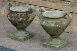 Pair composite stone classical style urns,