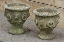 Pair 'Cotswold Studio' garden urns, decorated with lion masks,