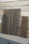 Four Victorian cast iron floor grates and another similar