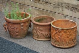 Three terracotta plant pots with moulded decoration (3)
