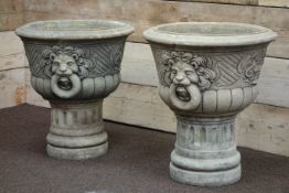 Pair composite stone garden urns on plinths with lion motif, D54cm,