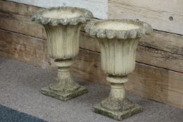 Pair stone effect flower shaped garden urns,