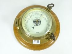 Nauticalia wall mounted barometer in the form of a porthole Condition Report