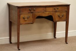 Early 20th century mahogany serpentine dressing table, four drawers, tapering supports with castors,
