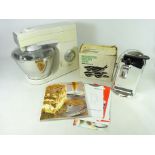 Kenwood Chef mixer with three attachments and instructions,