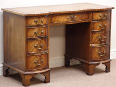 Reproduction mahogany serpentine kneehole desk, nine drawers, leather inset top, W116cm, H75cm,