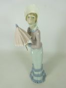 Large Lladro model of a girl with a parasol, H36.
