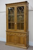 Light oak bookcase on cupboard, Gothic style raised bookcase with cluster column pilasters,
