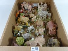 Fifteen Lilliput Lane cottages with some large models,