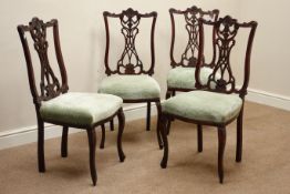 Set four Edwardian walnut dining chairs, carved fret work splat back,